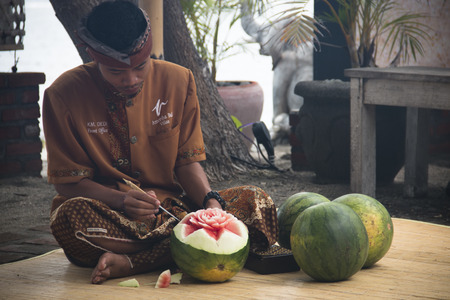 PEMUTERAN, BALI - JANUARY 2018: Watermelon carving is a very precise art performed by men in Bali, Indonesiaのeditorial素材