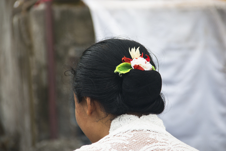 PEMUTERAN, BALI: A hindu priest performing offerings in a temple in Pemuteran in Bali, Indonesiaの写真素材