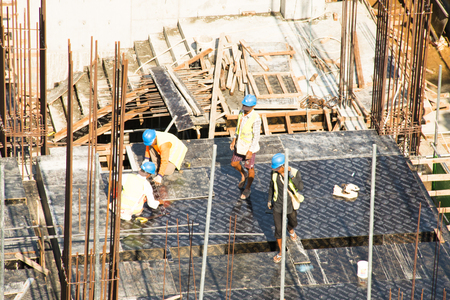 YANGON, MYANMAR â€“ MARCH 2018: Construction workers in the city of Yangon, the capital of...