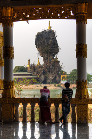 HPA-AN, MYANMAR â MARCH 2018: The Kyauk-Kalat Pagoda with is magnificent rock formation and temple near Hpa-An in Myanmarのeditorial素材