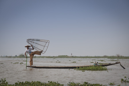INLE LAKE, MYANMAR - MARCH 2018: Typical fishermen on Inle Lake, one of the top tourist attractions of Myanmarのeditorial素材