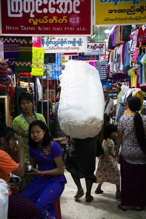 MANDALAY, MYANMAR - MARCH 2018: People inside a very colorful market in the center of Mandalay in Myanmarのeditorial素材