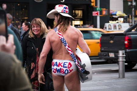 NEW YORK CITY, USA â APRIL 2018: Traffic and billboards on Times Square in Manhattan, New York City, USA with the naked cowboyのeditorial素材