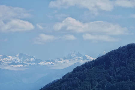 beautiful landscape view of the aare river and the mountains in the distanceの写真素材