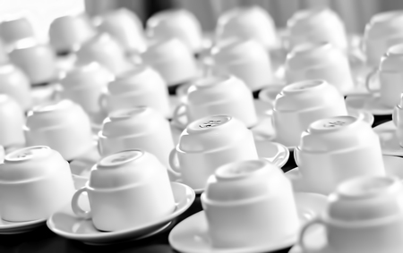 several coffee cups on a coffee break tableの写真素材