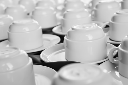 Several coffee cups on a coffee break tableの写真素材