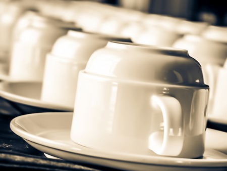 Several coffee cups on a coffee break tableの写真素材