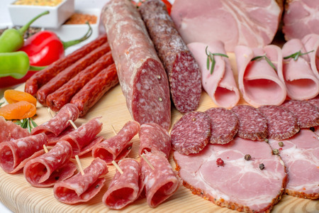 smoked meat on wood isolated on white.の写真素材