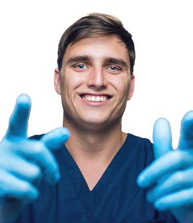 Smiling surgeon over white background.の写真素材