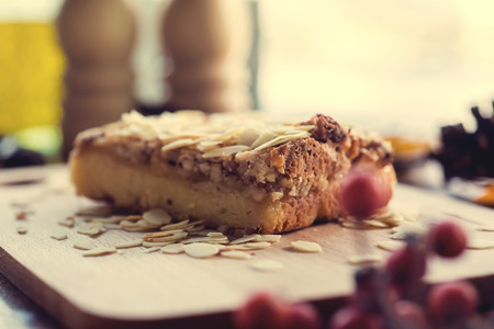 Pieces of apple pie decorated on wooden table.の写真素材