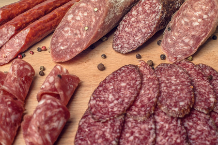 smoked meat on wood isolated on white.の写真素材
