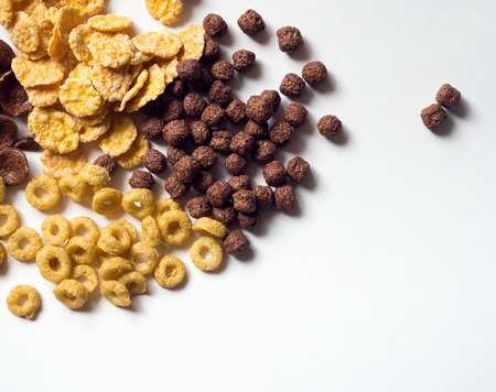 Different kind of cornflakes on white