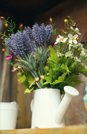 Summer flowers in vase on wooden .の写真素材