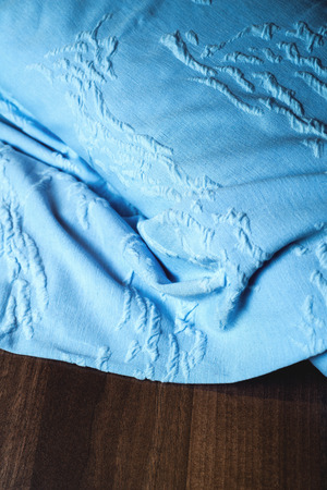 Blue textile on wooden .の写真素材