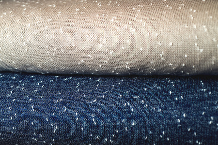 Rolls of blue and brown fabric as a vibrant image.