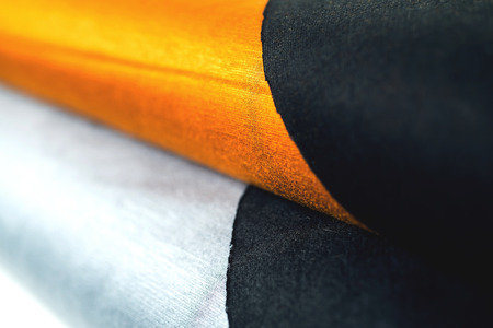 Rolls of colorful fabric as a vibrant image.