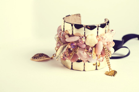 Golden fashion handmade bracelet on white .の写真素材