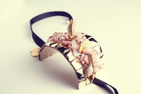 Golden fashion handmade bracelet on white background.の写真素材