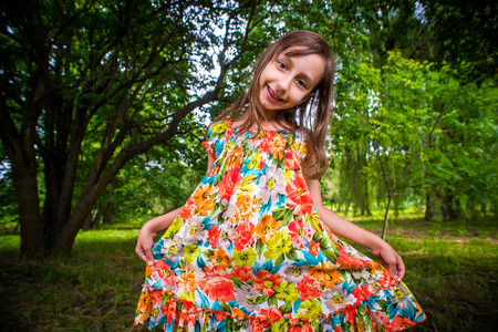 Happy little girl having fun at the park..の写真素材