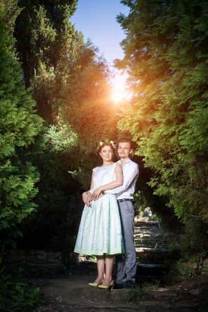 Wedding shot of bride and groom in park.の写真素材