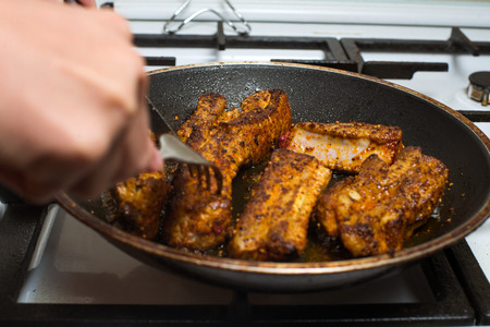 Close up grilled pork on frying pan.の写真素材
