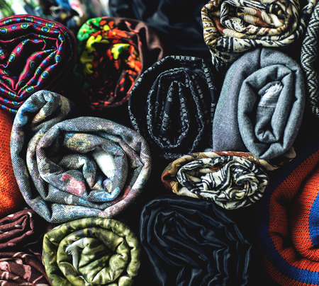 Rolls of colorful fabric as a vibrant background image.の写真素材