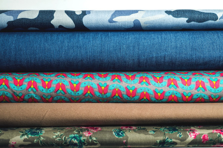 Rolls of colorful fabric as a vibrant background image.の写真素材