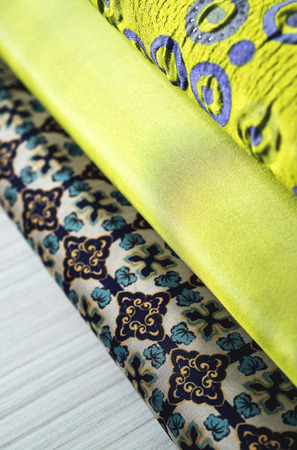 Rolls of colorful fabric as a vibrant background image.の写真素材