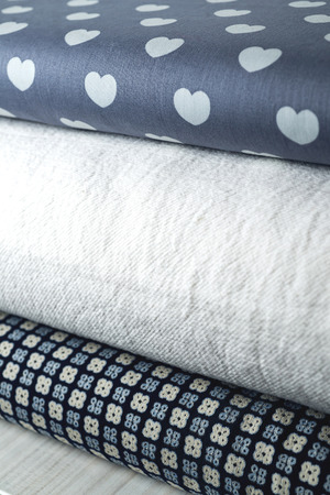 Rolls of colorful fabric as a vibrant background image.の写真素材