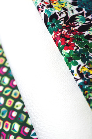 Rolls of colorful fabric as a vibrant background image.の写真素材