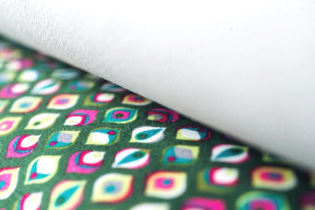 Rolls of colorful fabric as a vibrant background image.の写真素材