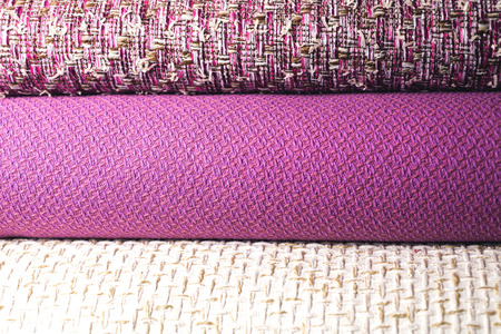 Rolls of colorful fabric as a vibrant background image.の写真素材