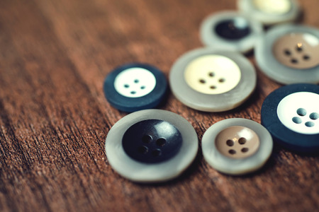 close up, buttons on wood floor background.の写真素材