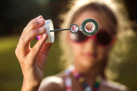 The image of a cute little girl with bubbles.