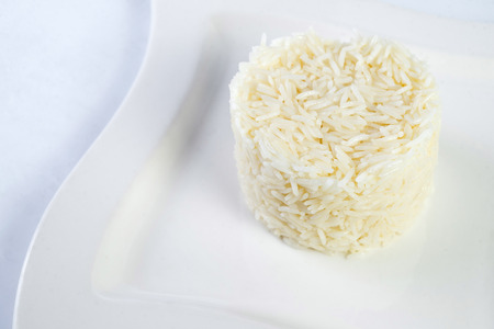 Plate of boiled rice on White Background.の写真素材
