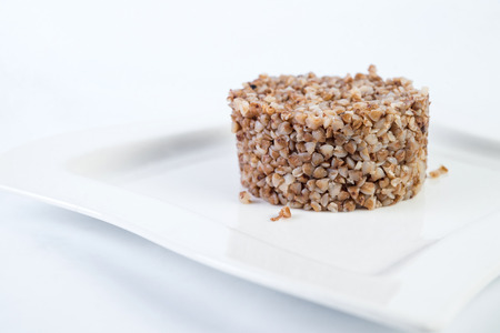 boiled buckwheat porridge in plate at home.の写真素材
