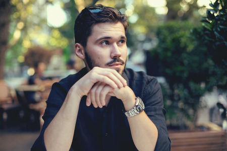 handsome big moustache hipster man in the city cafe.の写真素材