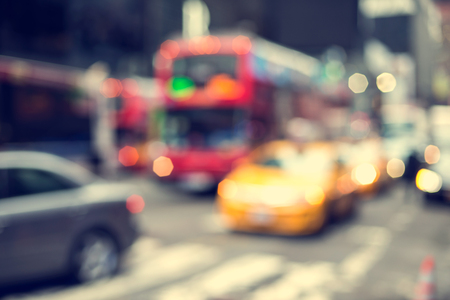 Blurry abstract photo of yellow taxi cabs in Times Square in Manhattan.の写真素材
