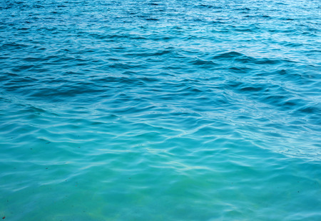 Transparent clear, clean water with sunlight reflection.