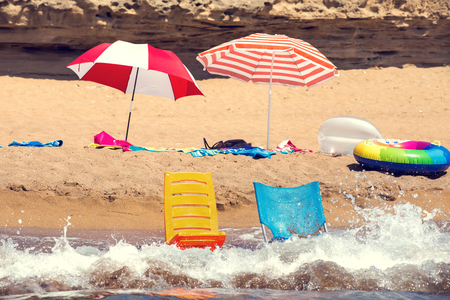 Beach chairs on pebble beach, beautiful blue sky and sea.の写真素材
