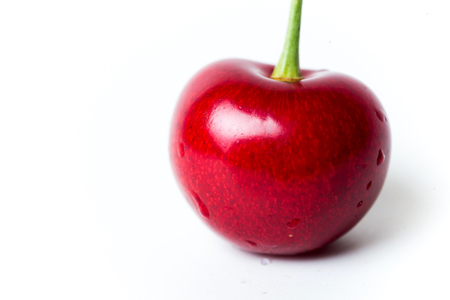 Heart shaped cherry berry isolated on white background cutout.の写真素材