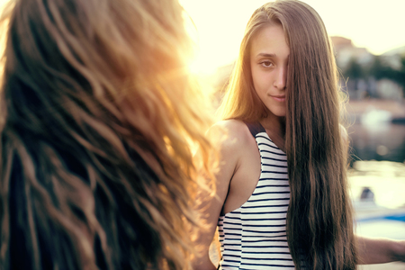 Young pretty woman at sunset in Italyの写真素材