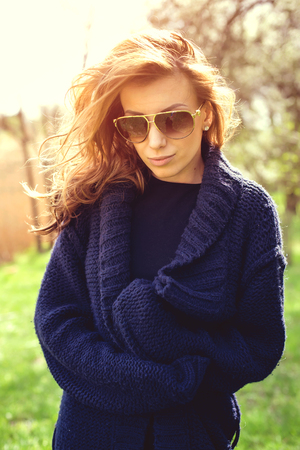 Portrait of a sexy girl in city park. Shooting at sunsetの写真素材