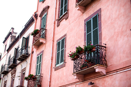 windows of colorful house in Bosa. Italy.の写真素材