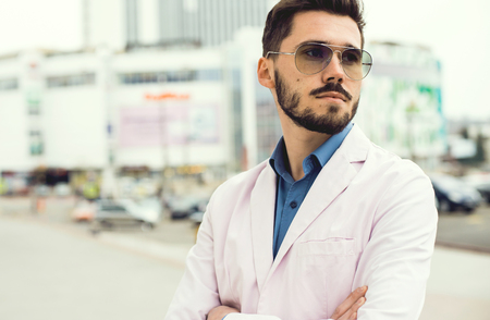 Portrait of an handsome businessman in the streetの写真素材