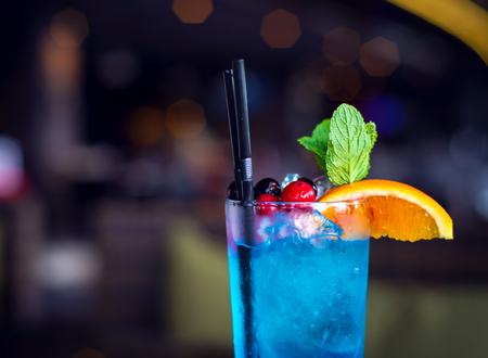 Refreshing cocktail with orange, berries and mint.の写真素材