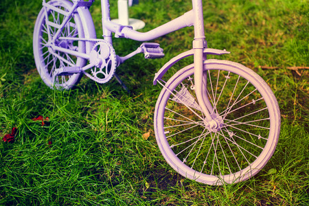 Vintage pink bicycle with flower basket.の写真素材