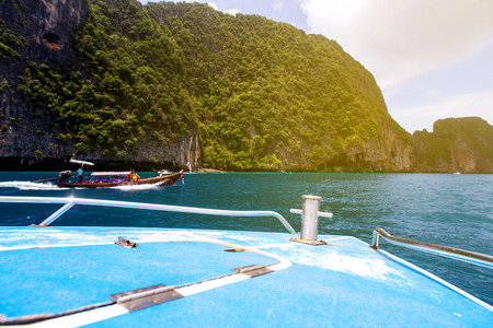 Traditional boat in a picture perfect tropical bay on Koh Phi Phi Island, Thailand, Asiaの写真素材