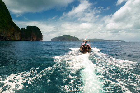 Traditional boat in a picture perfect tropical bay on Koh Phi Phi Island, Thailand, Asiaの写真素材