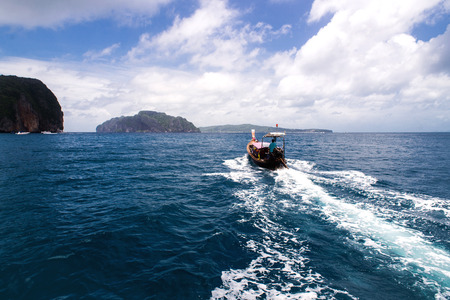 Traditional boat in a picture perfect tropical bay on Koh Phi Phi Island, Thailand, Asiaの写真素材